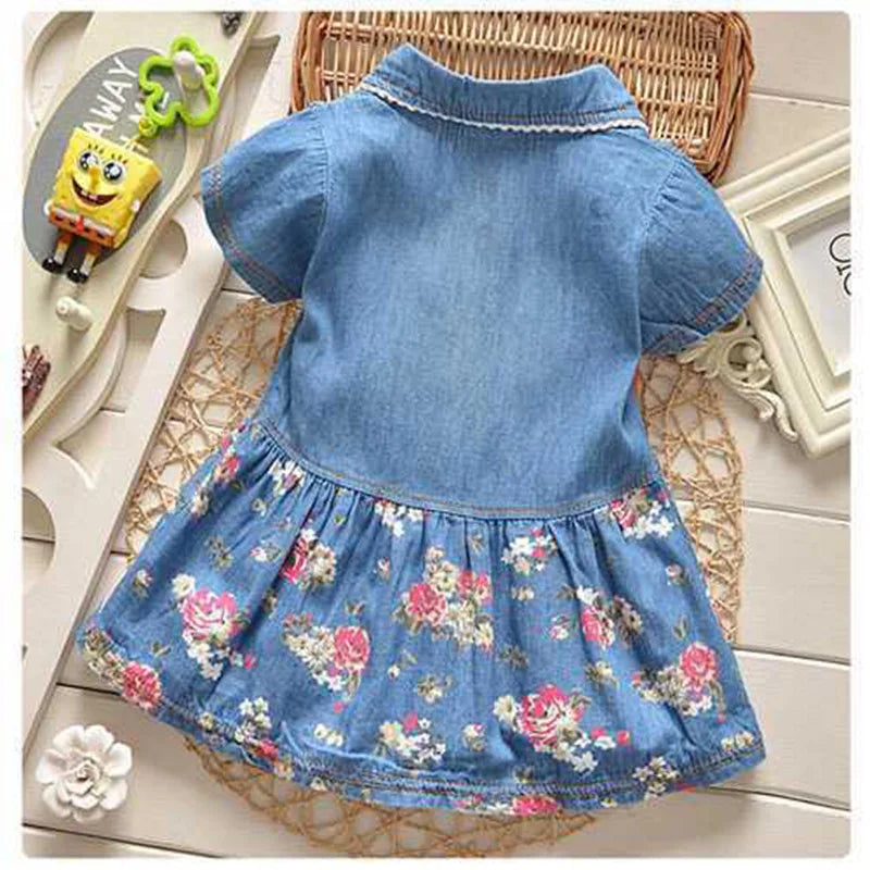 Baby Girls Denim Floral Dress Ages 12M–4T | Bow & Button Detail